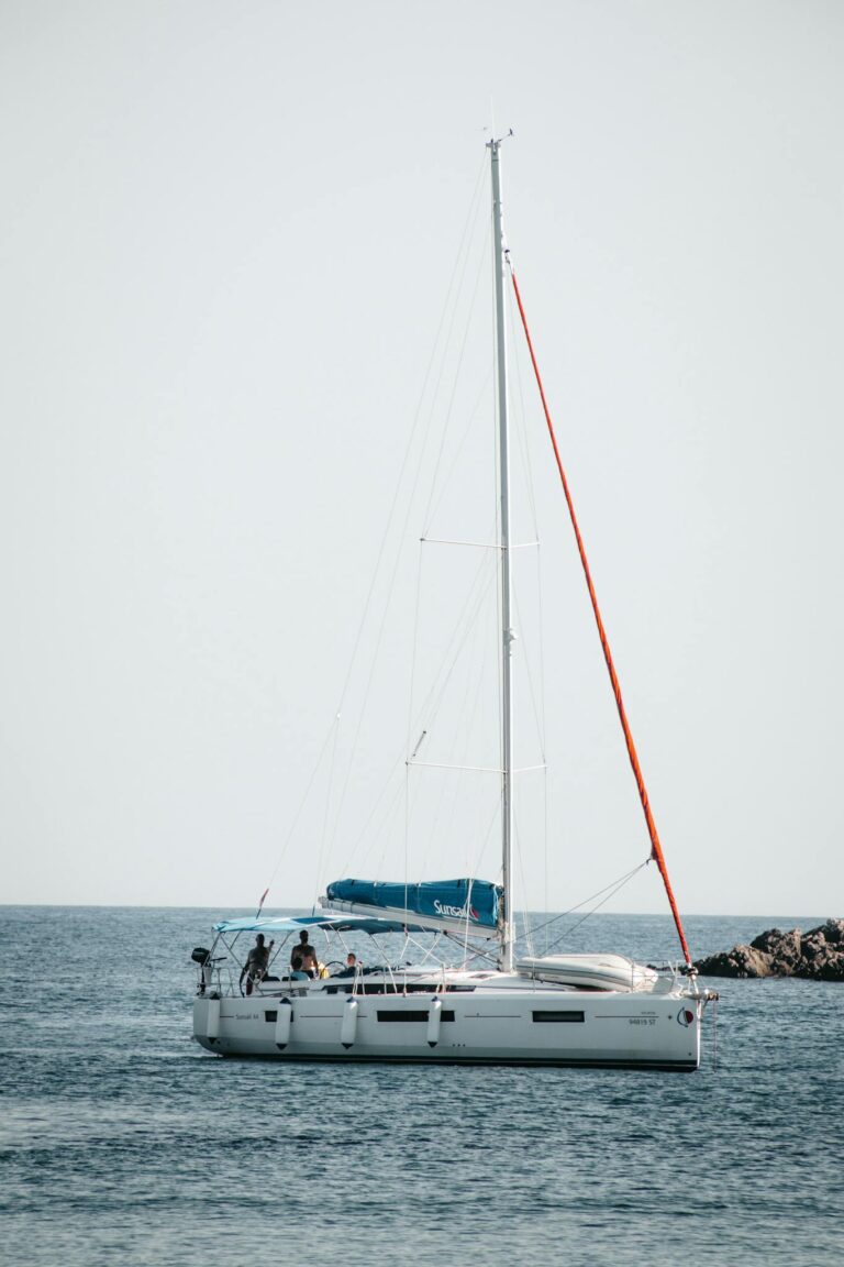Serene scene of a sailboat on the calm Adriatic Sea off Lopud, Croatia.